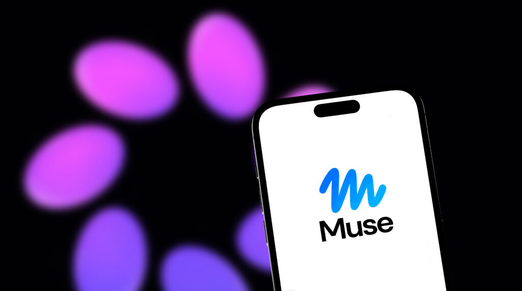 Smartphone displaying the Meta Muse AI agent logo with a blurred Meta background